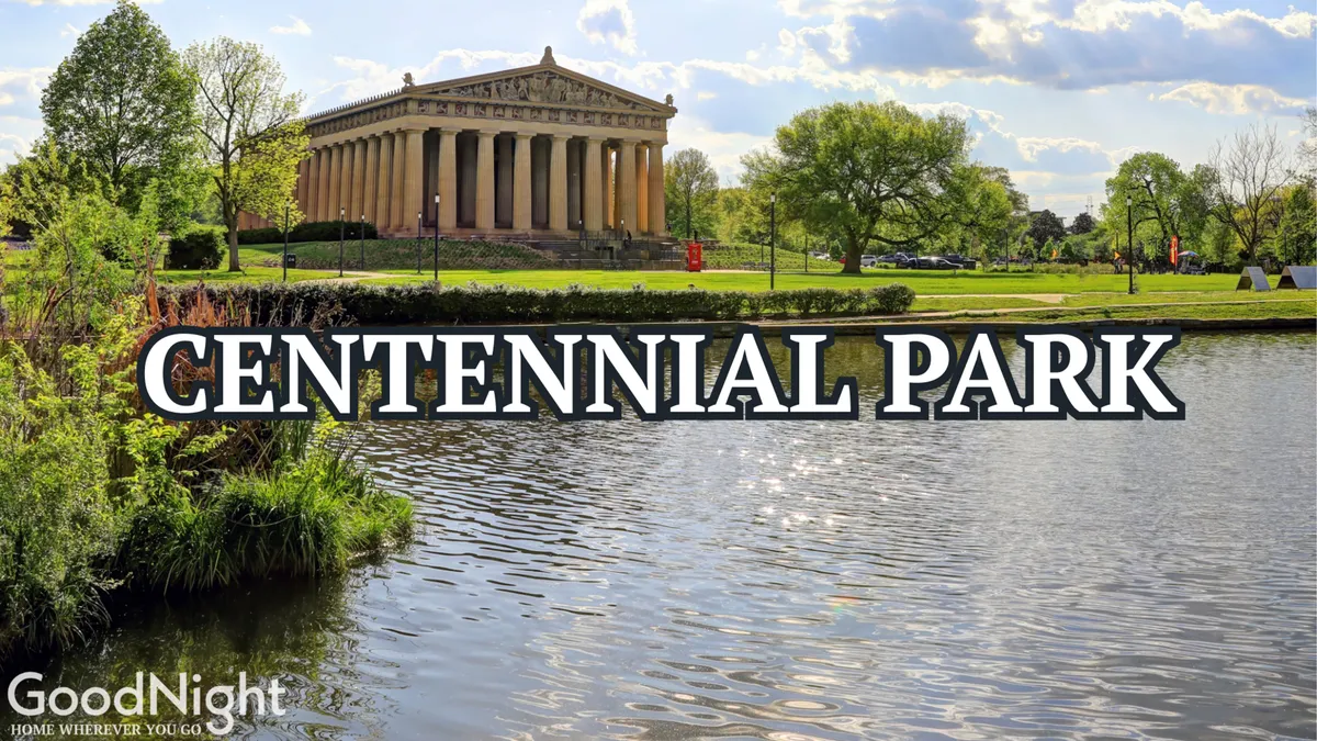This image showcases the iconic Parthenon replica set amidst a tranquil lake and lush greenery in Centennial Park. The calm water reflects the grand structure, and the surrounding natural landscape invites families for picnics, strolls, and photography.